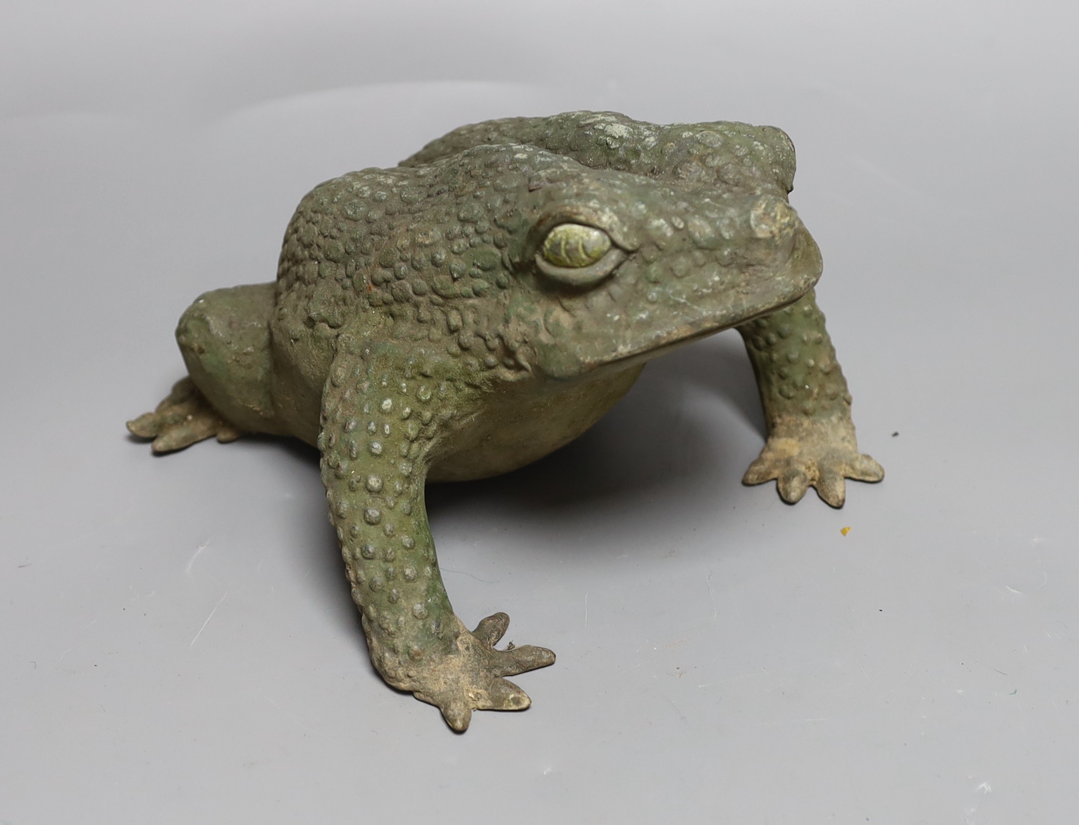 A Japanese bronze model of a toad, 25cms long